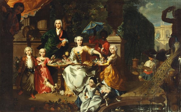 Familiegruppe på en terrasse ved en villa. Muligvis den engelske forretningsmand George Jackson med sin familie